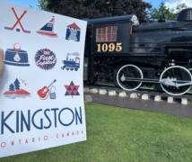 Kingston poster in front of the train